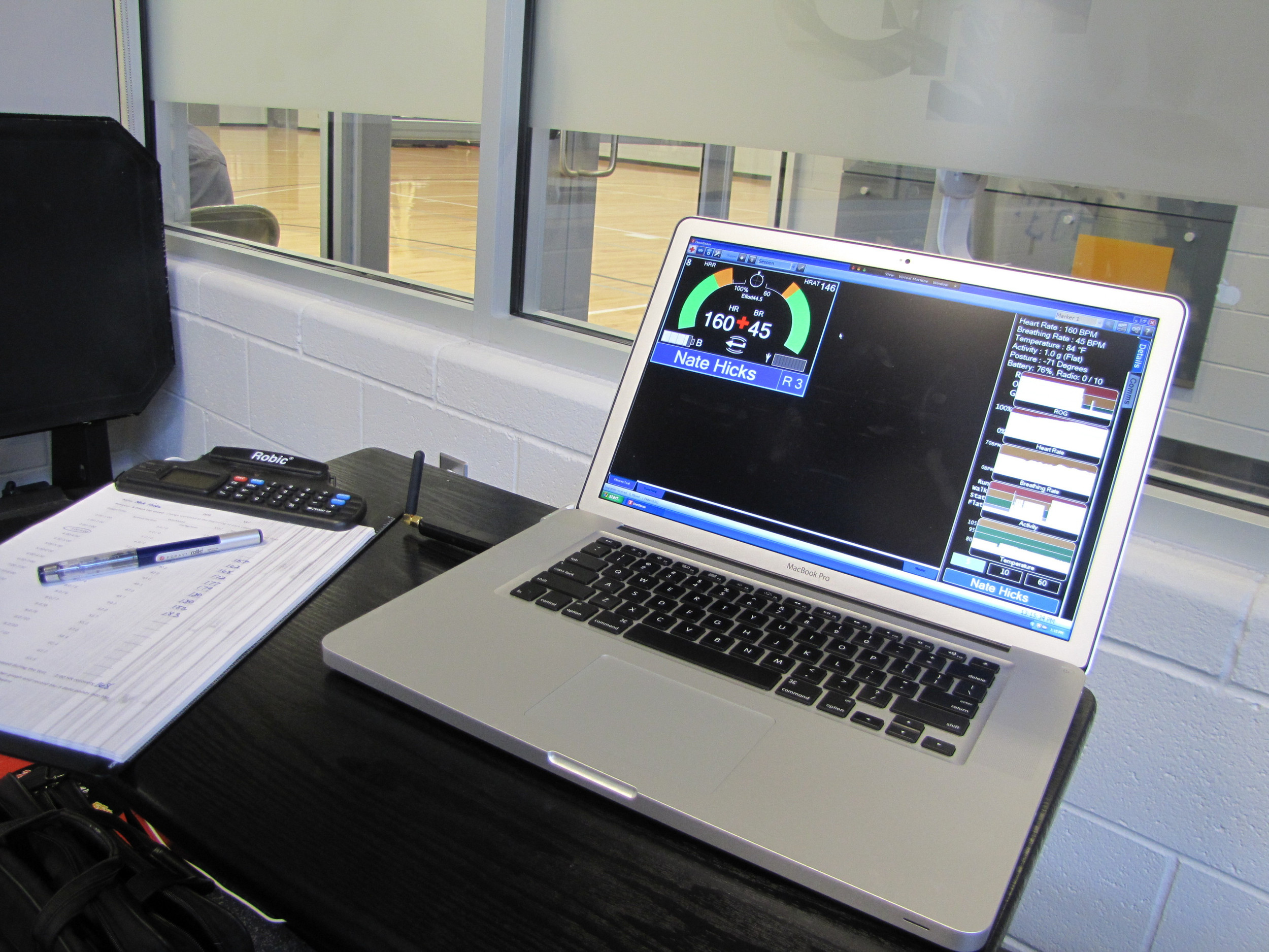 Strength coach Mike Bewley gathers data from treadmill tests on this laptop.