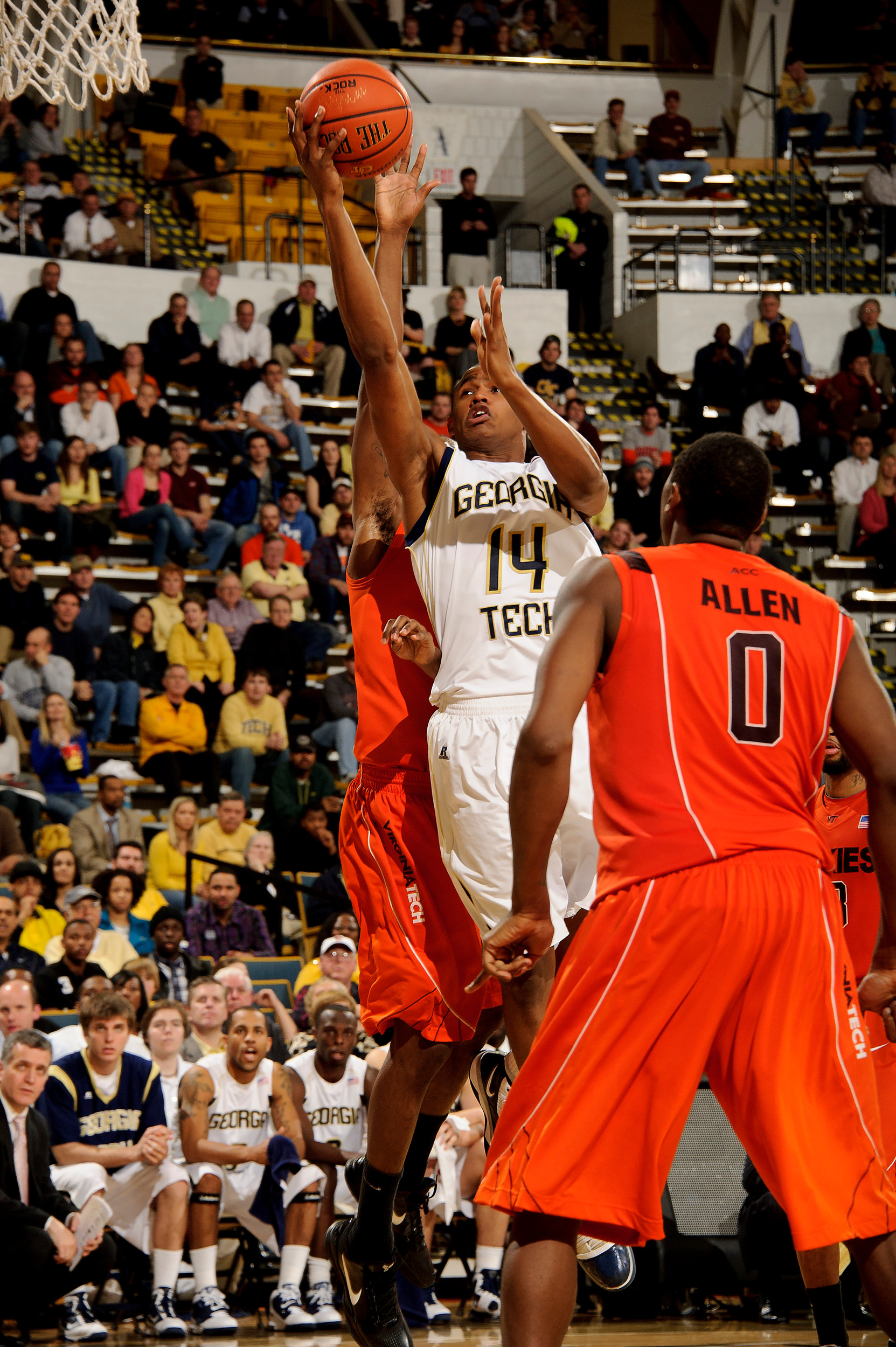 Jan 25, 2011; Atlanta, GA, USA;Georgia Tech Yellow Jackets guard Jason Morris (14) drives to the basket for a shot against Virginia Tech Hokies forward Jeff Allen (0) during the first half at Alexander Memorial Coliseum. Georgia Tech defeated Virginia Tech 72-57. Mandatory Credit: Paul Abell-US PRESSWIRE