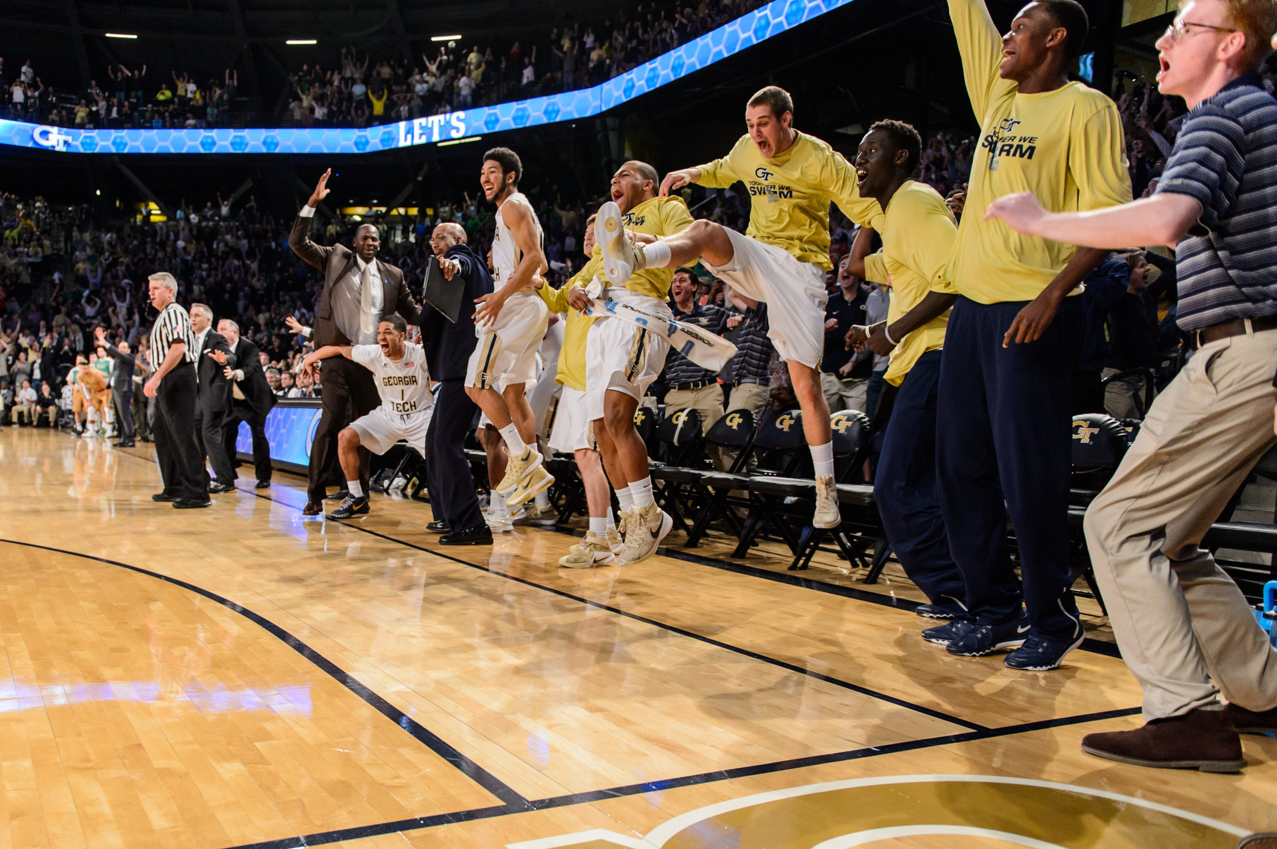 The bench reacts to Marcus Georges-Hunt's shot