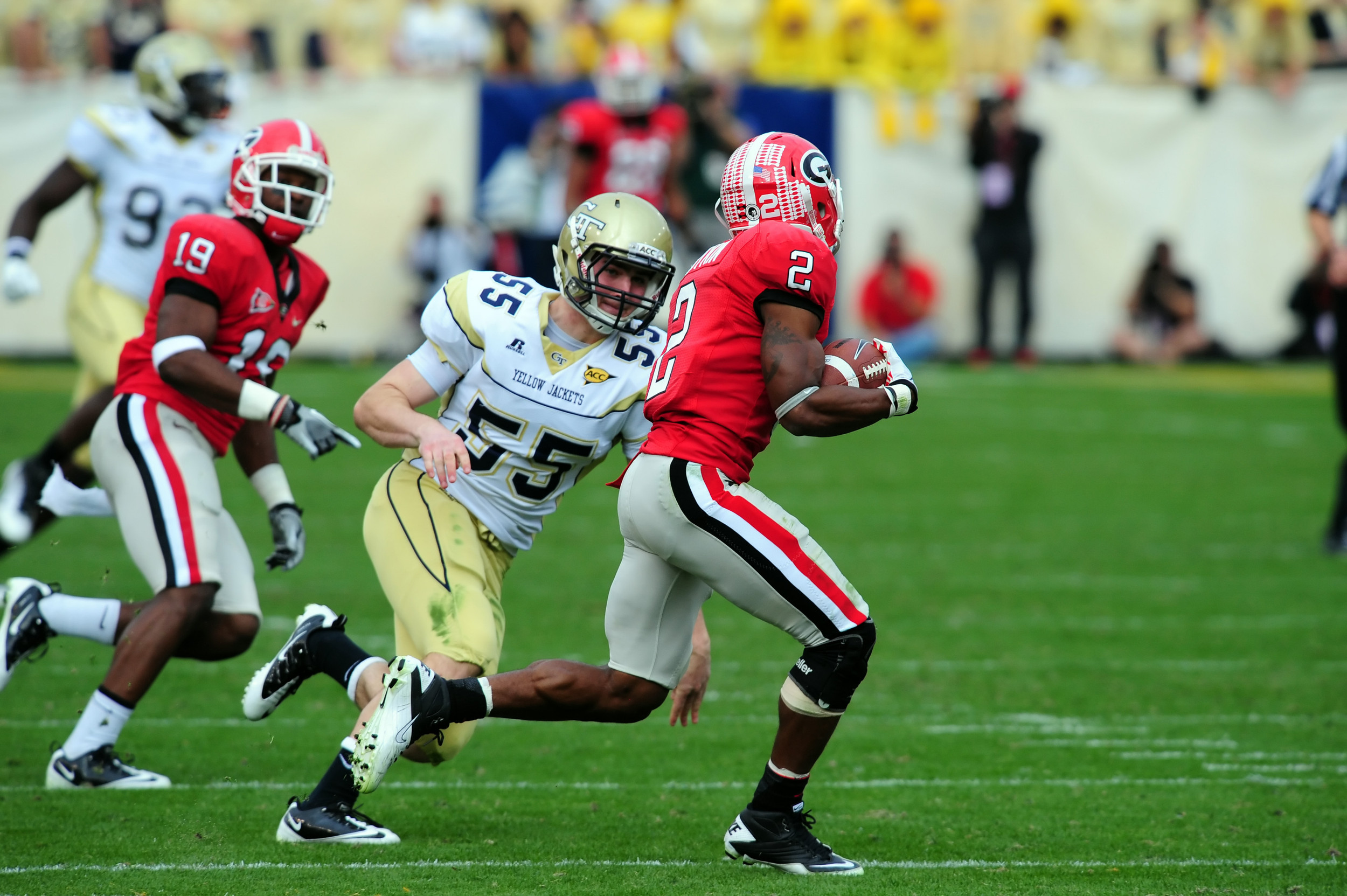 Georgia Tech linebacker Sean Tobin helps to track down Georgia's return man on a kick off.Georgia Tech vs GeorgiaAtlanta, GANovember 26, 2011Photos by David Johnson/LensEffects