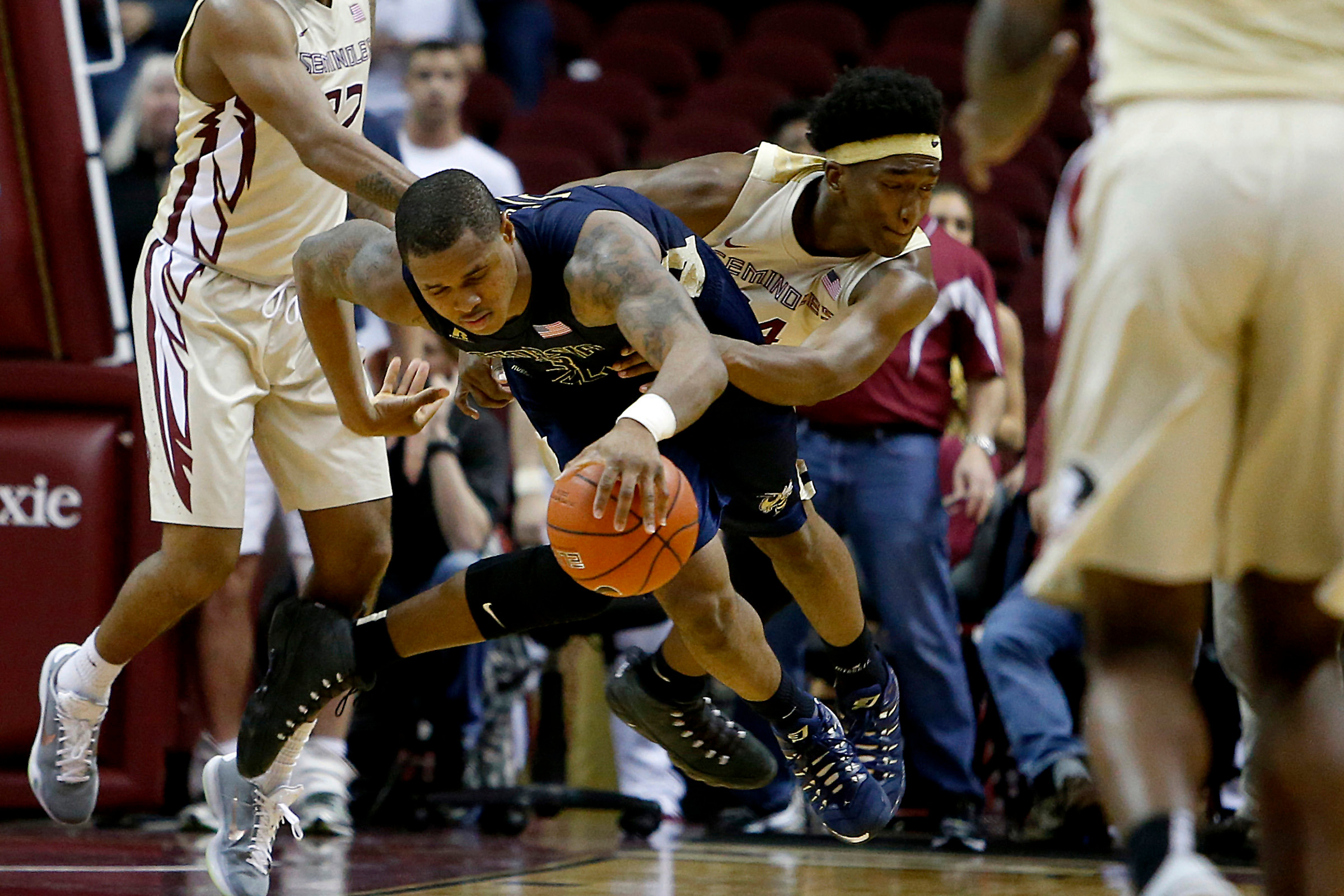 Marcus Georges-Hunt is fouled by Florida State Seminoles guard Terance Mann. Glenn Beil-USA TODAY Sports