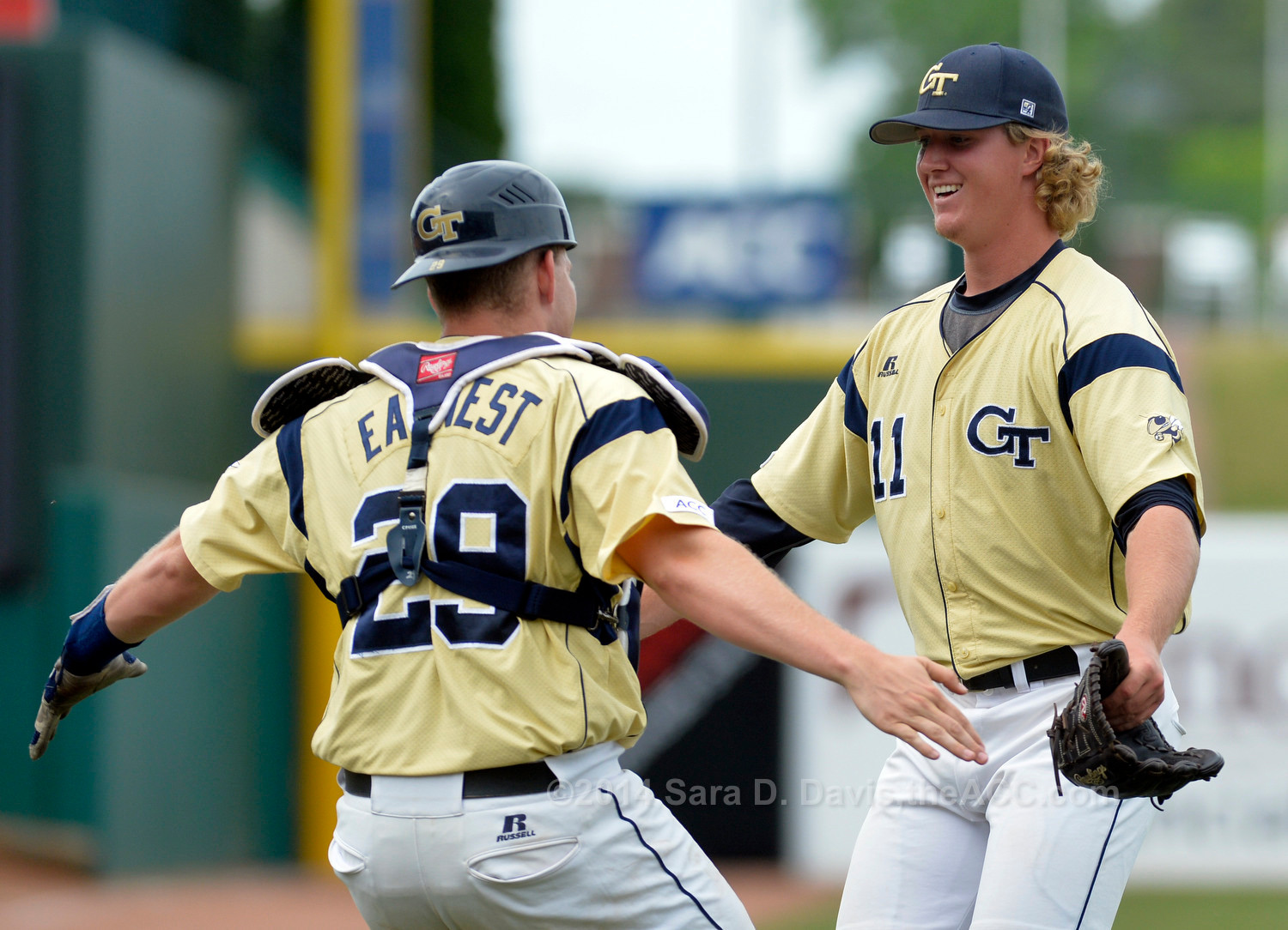 Georgia Tech pitcher Sam Clay (11) and catcher Mitch Earnest (29) run to hug after clinching the 2014 ACC Baseball Championship in Greensboro, N.C., May 25, 2014. (Photo by Sara D. Davis, theACC.com)