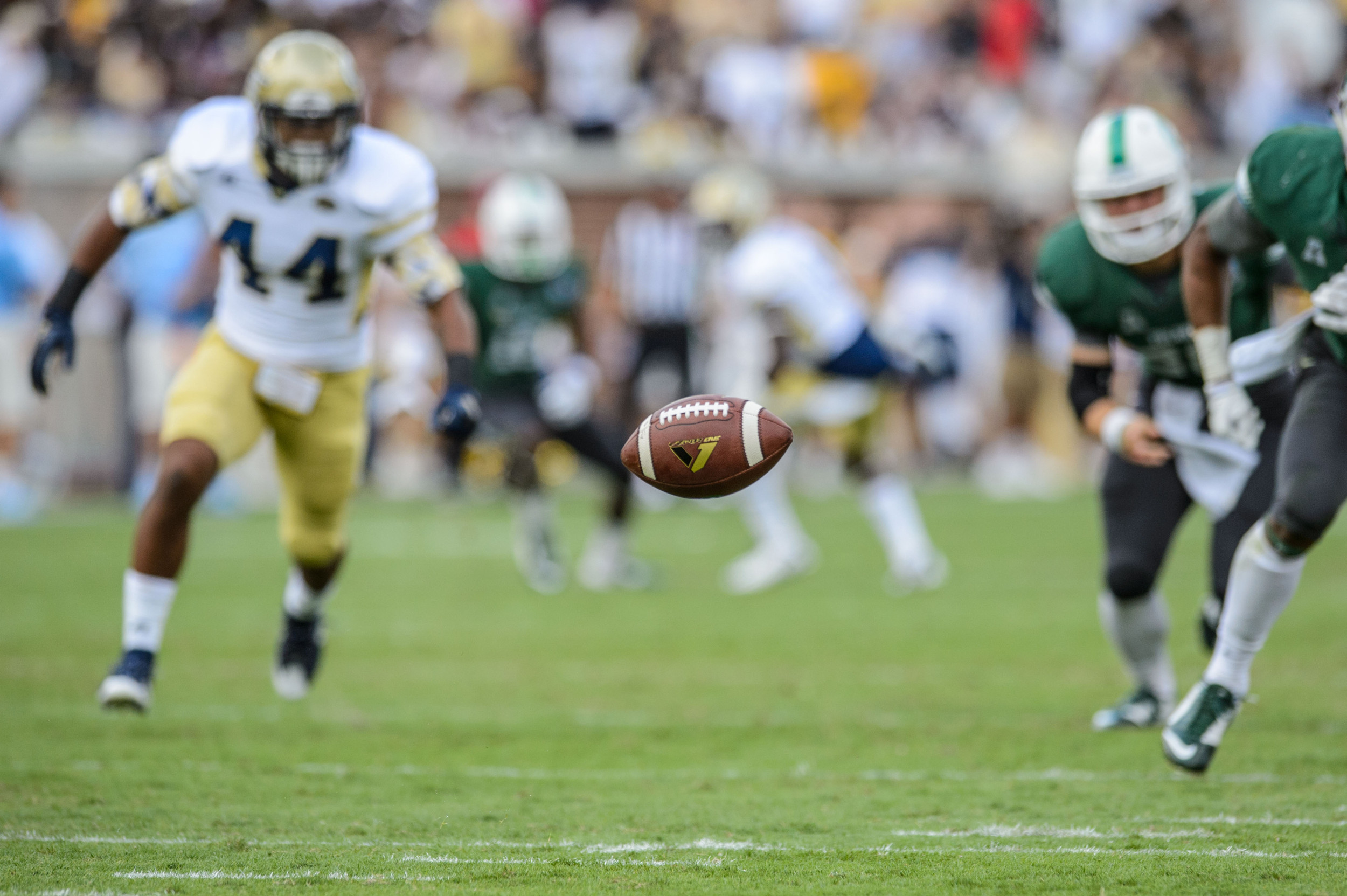 The ball bounces on the field after the blocked punt