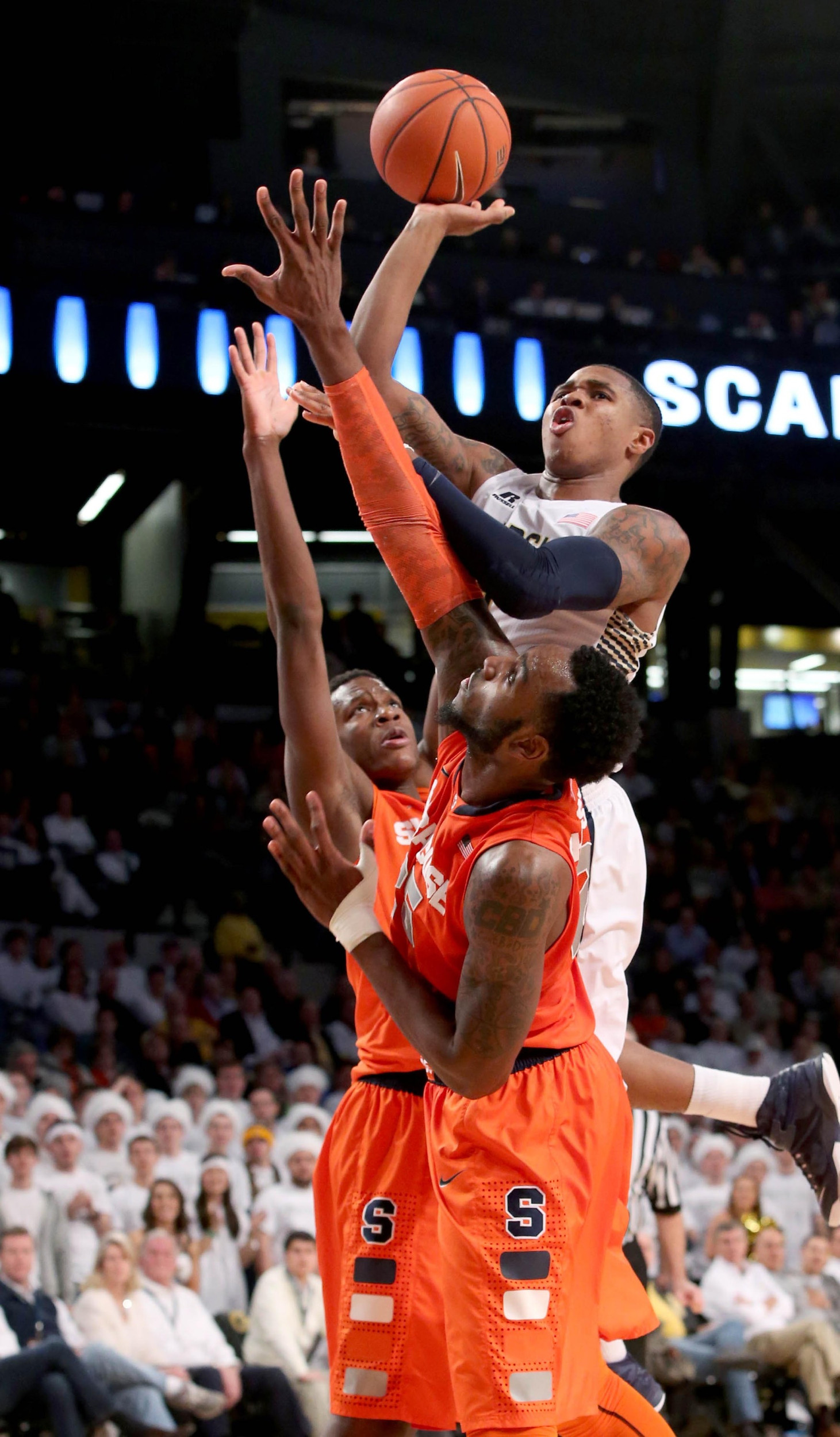 Georgia Tech Yellow Jackets forward Marcus Georges-Hunt (3) attempts a shot against the defense of Syracuse Orange forward Tyler Roberson (21) and forward Rakeem Christmas (25) in the second half of their game at McCamish Pavilion. Syracuse won 46-45. Jason Getz-USA TODAY Sports