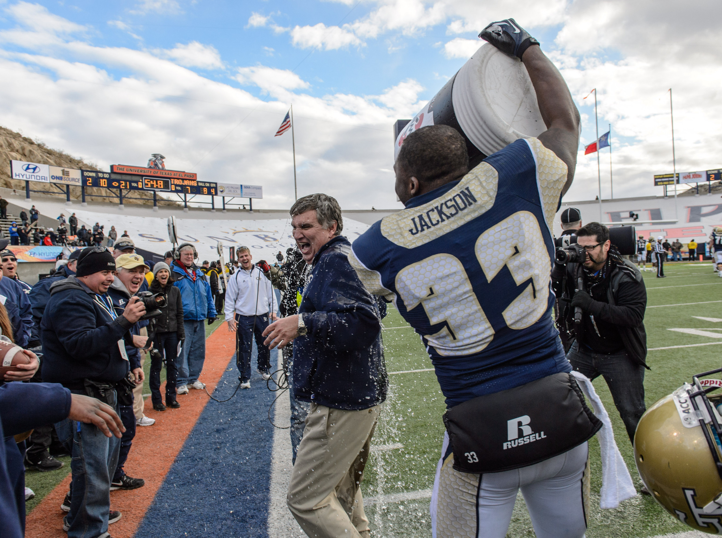 Coach Paul Johnson gets doused with water as the Jackets beat the Trojans.