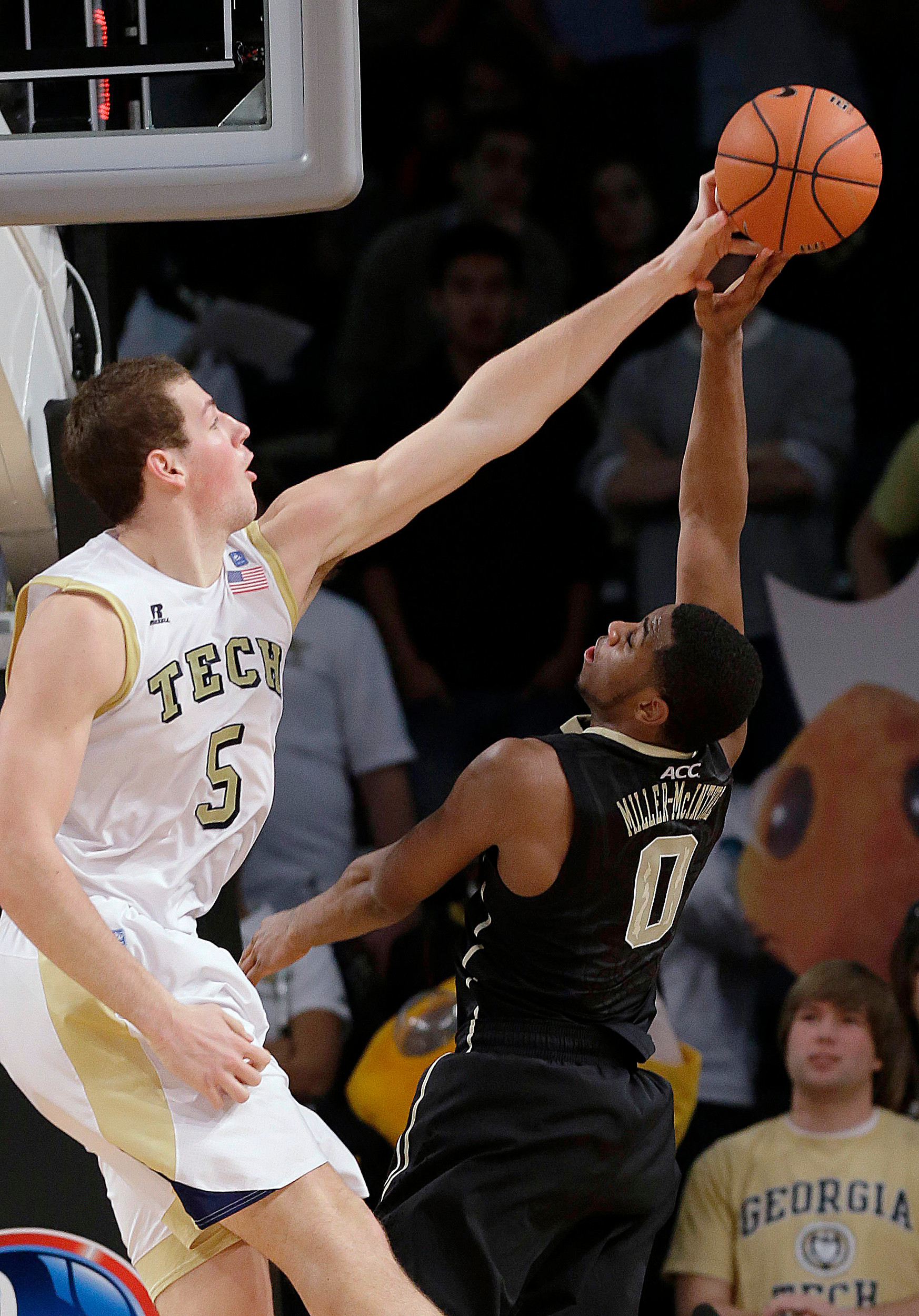 Wake Forest guard Codi Miller-McIntyre (0) has his shot blocked by Georgia Tech center Daniel Miller (5) during the second half. (AP Photo/John Bazemore)