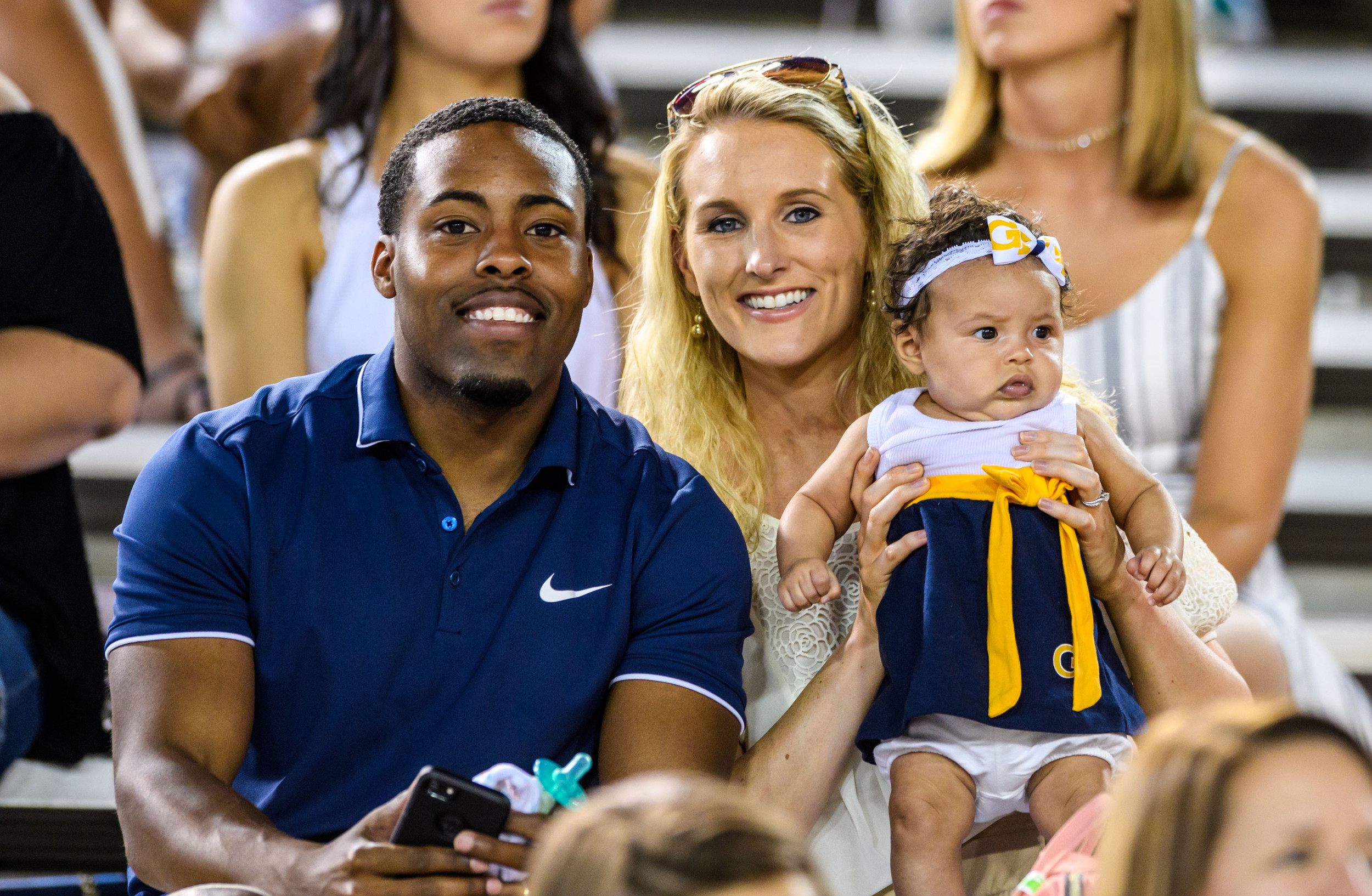 Alumni Tony Zenon attended the game with his wife and daughter