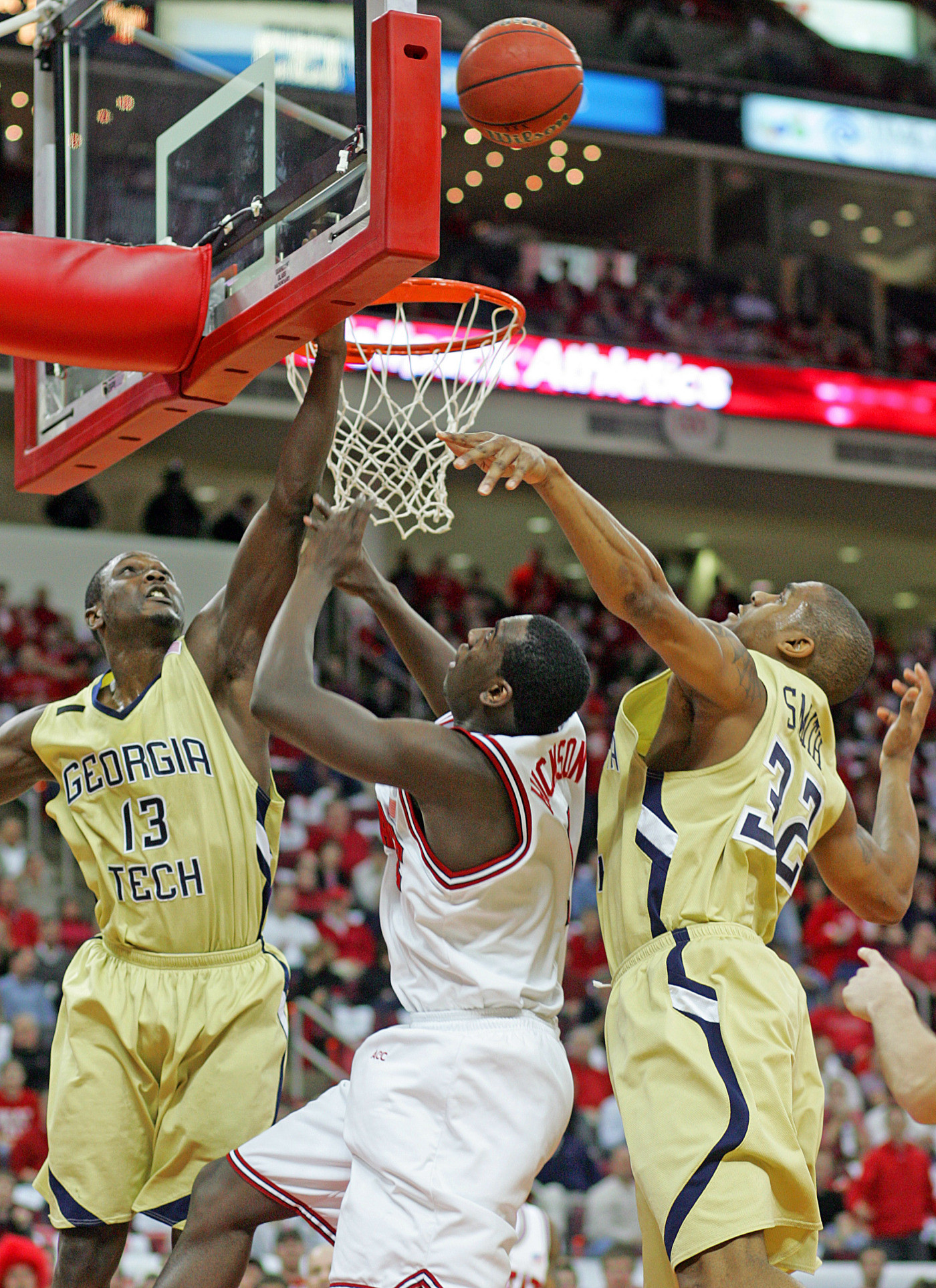North Carolina State's J.J. Hickson (1) tries to split the defense of Georgia Tech's D'Andre Bell (13) and Jeremis Smith during the first half of a basketball game in Raleigh, N.C., Wednesday, Jan. 23, 2008. Georgia Tech won 77-74.