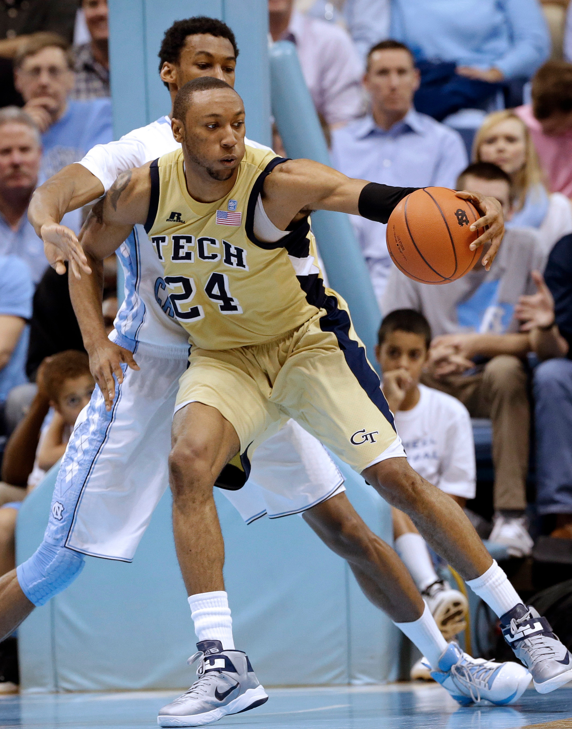 North Carolina's Desmond Hubert guards Georgia Tech's Kammeon Holsey (24) during the second half. (AP Photo/Gerry Broome)