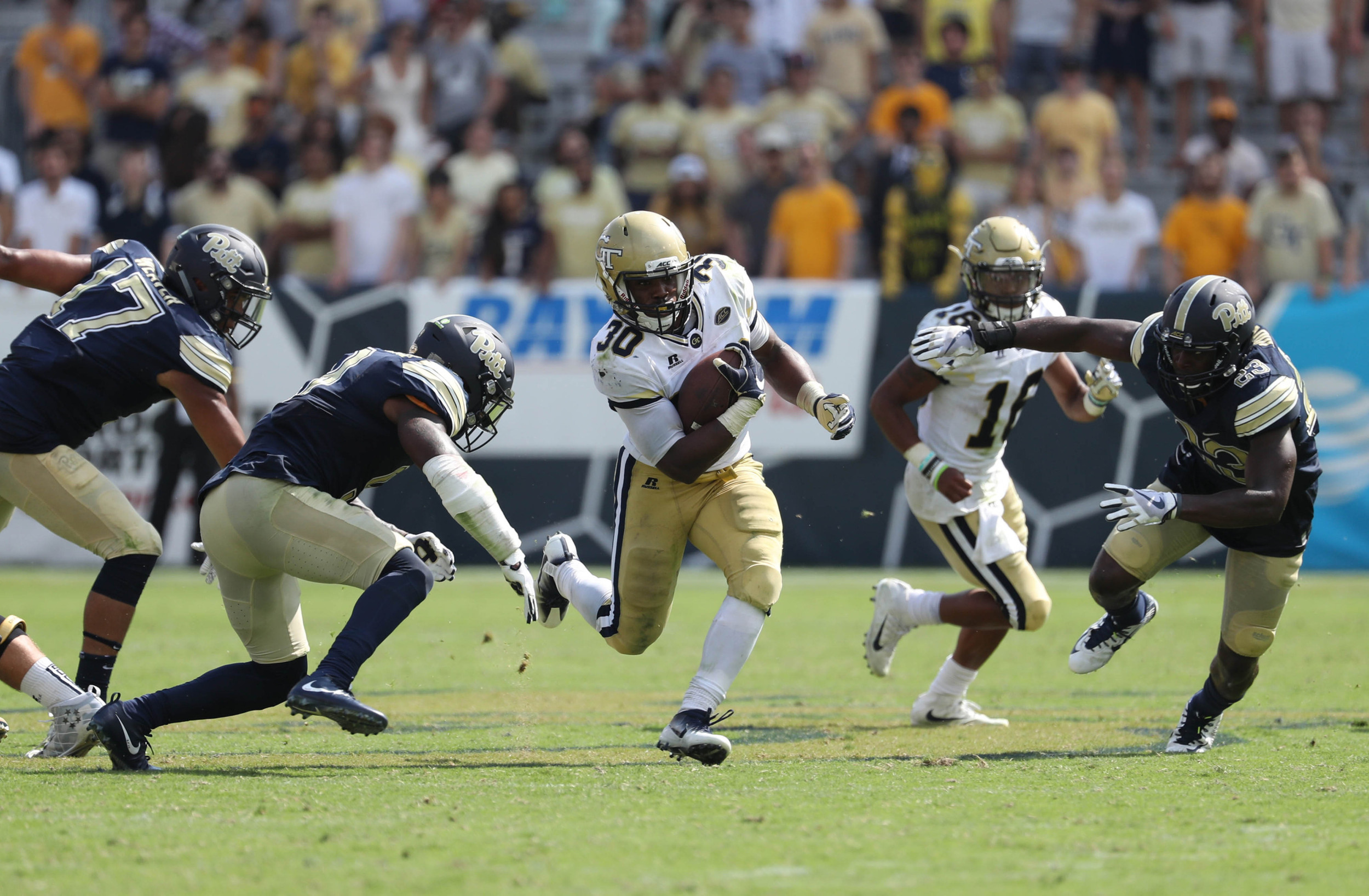 Sep 23, 2017; Atlanta, GA, USA; Georgia Tech Yellow Jackets running back KirVonte Benson (30) runs for a 47-yard touchdown run in the fourth quarter against the Pittsburgh Panthers at Bobby Dodd Stadium. Mandatory Credit: Jason Getz-USA TODAY Sports