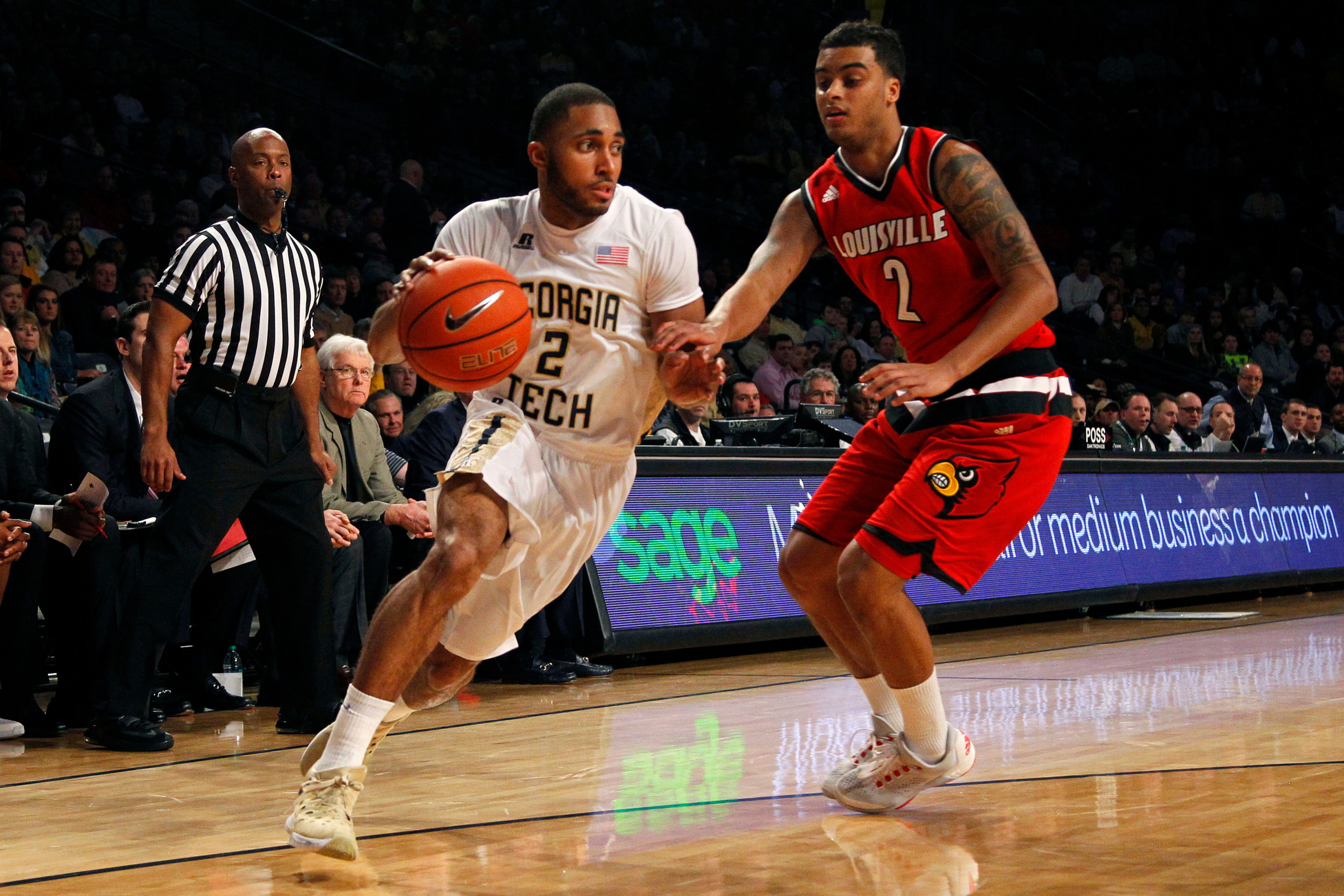 Jan 23, 2016; Atlanta, GA, USA; Georgia Tech Yellow Jackets guard Adam Smith (2) drives past Louisville Cardinals guard Quentin Snider (2). Credit: Brett Davis-USA TODAY Sports