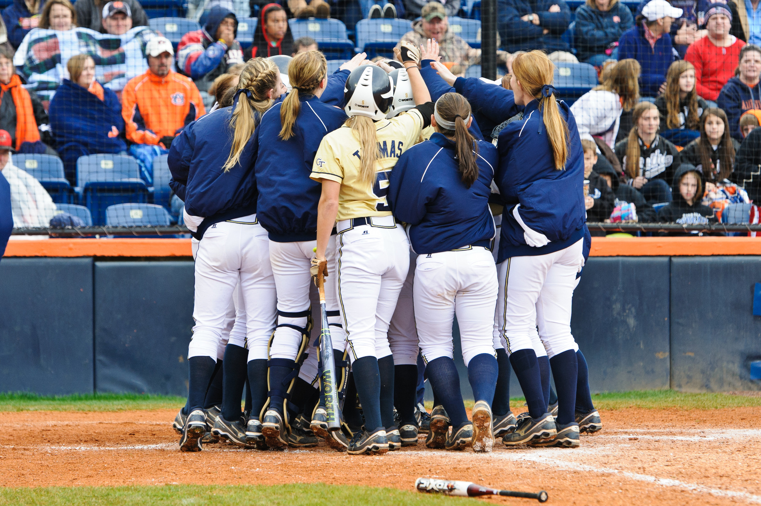 The team celebrates Danielle Dike's home run.