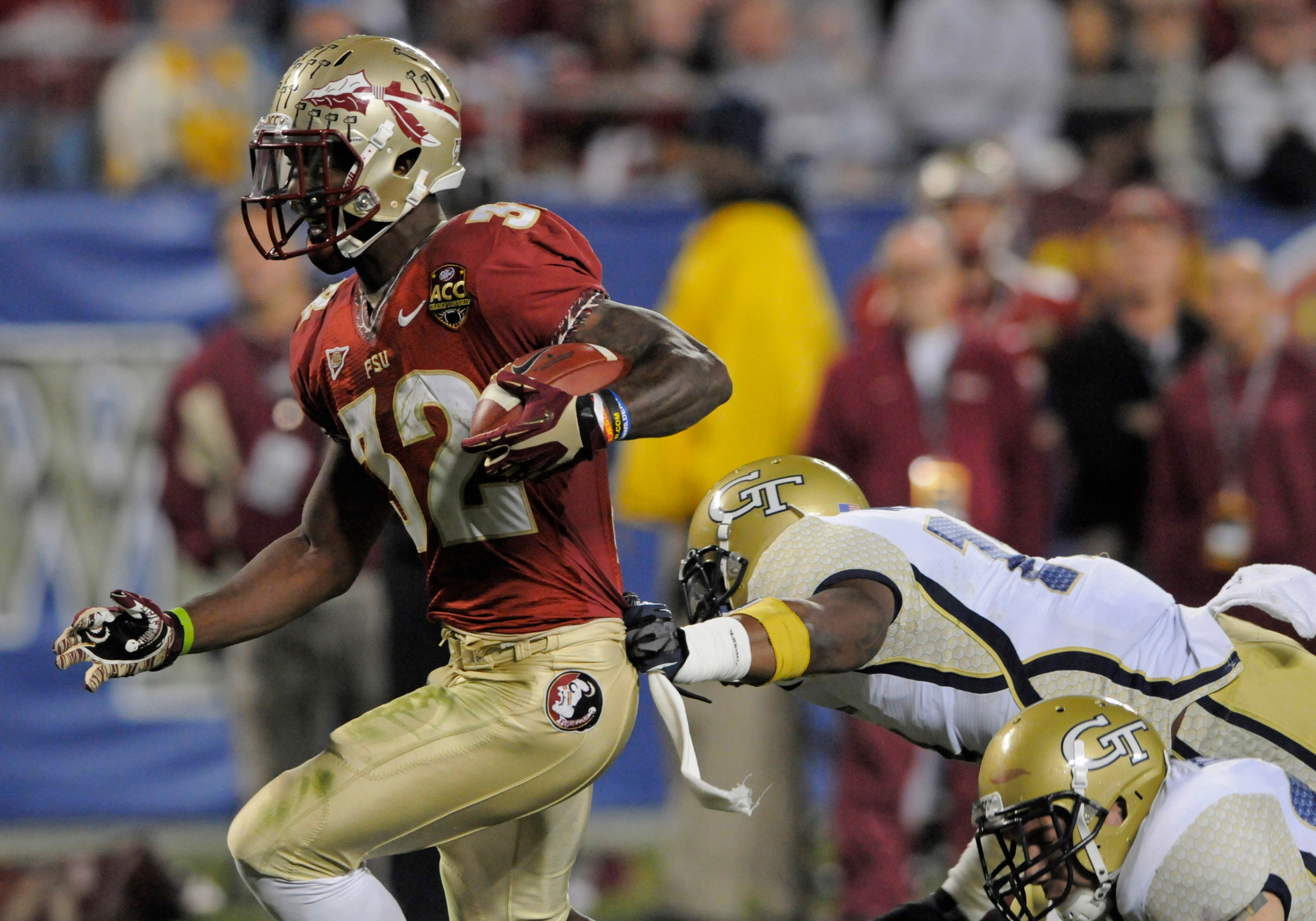 Florida State's James Wilder Jr. (32) runs into the end zone for a touchdown past Georgia Tech's Brandon Watts (11) during the first half of the ACC Championship college football game in Charlotte, N.C., Saturday, Dec. 1, 2012. (AP Photo/Mike McCarn)