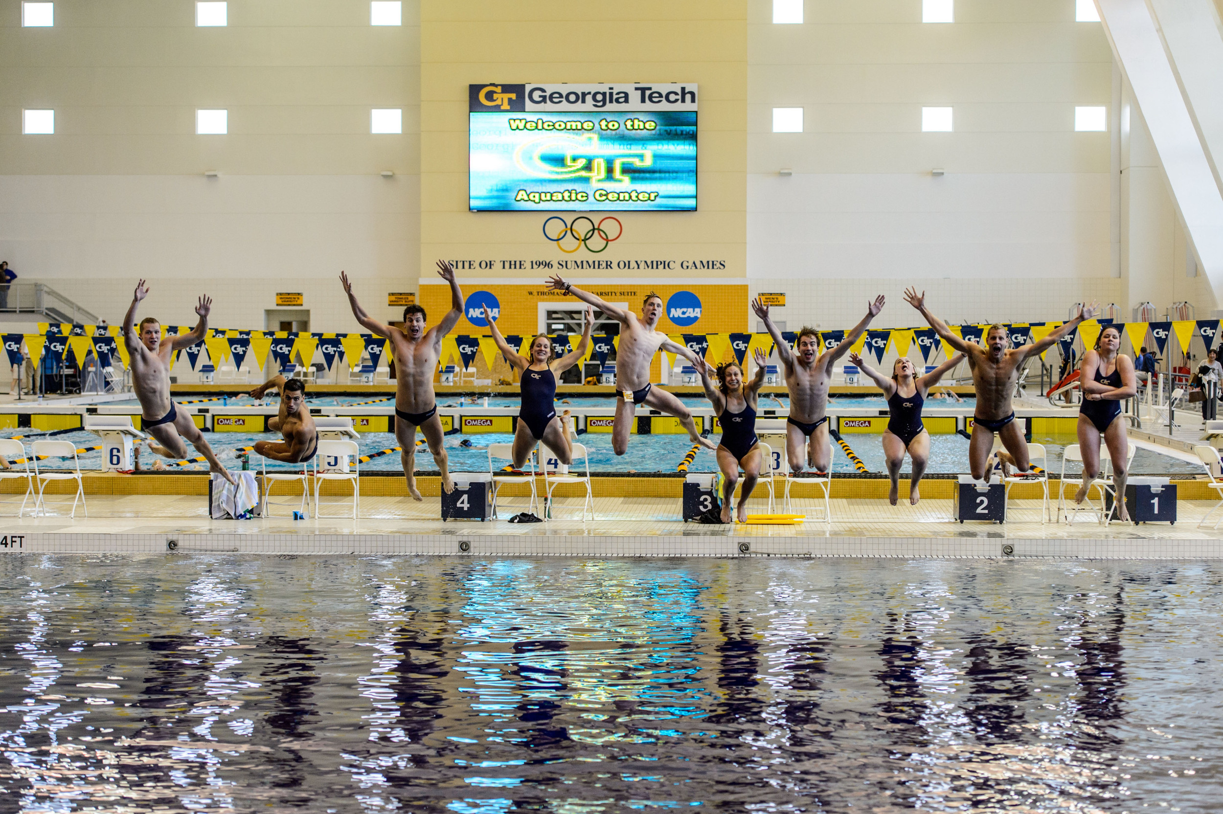 Seniors Kate Brandus, Elliott Brockelbank, Andrew Chetcuti, Dylan Kase, Andrew Kosic, Kelsey Maloney, Catherine Richards, Mark Sarman, Nico van Duijn, and Kate Woolbright leap into the pool at the end of the meet