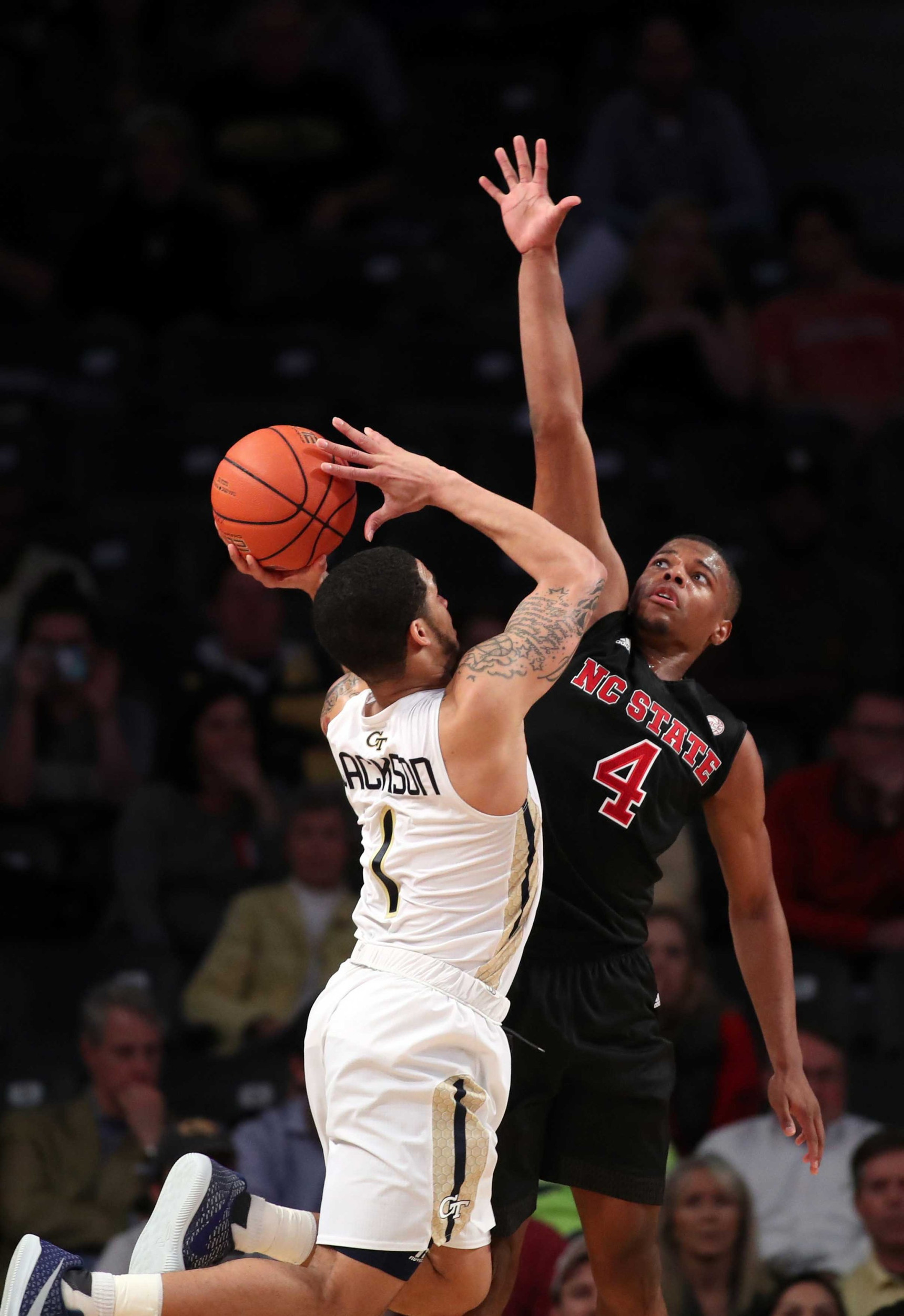Guard Tadric Jackson attempts a shot against North Carolina State Wolfpack guard Dennis Smith Jr. in the second half of their game. Credit: Jason Getz-USA TODAY Sports