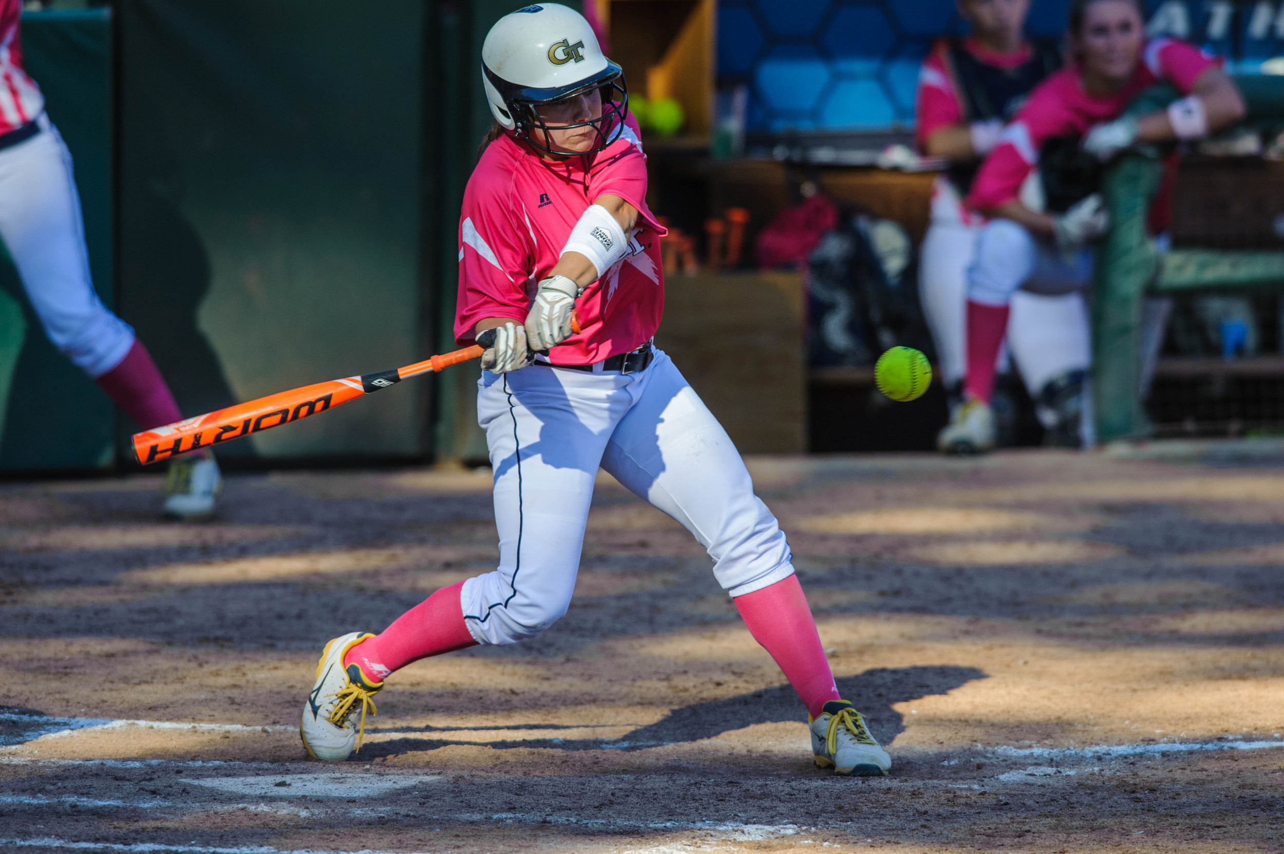 A Georgia Tech player swings at the ball.